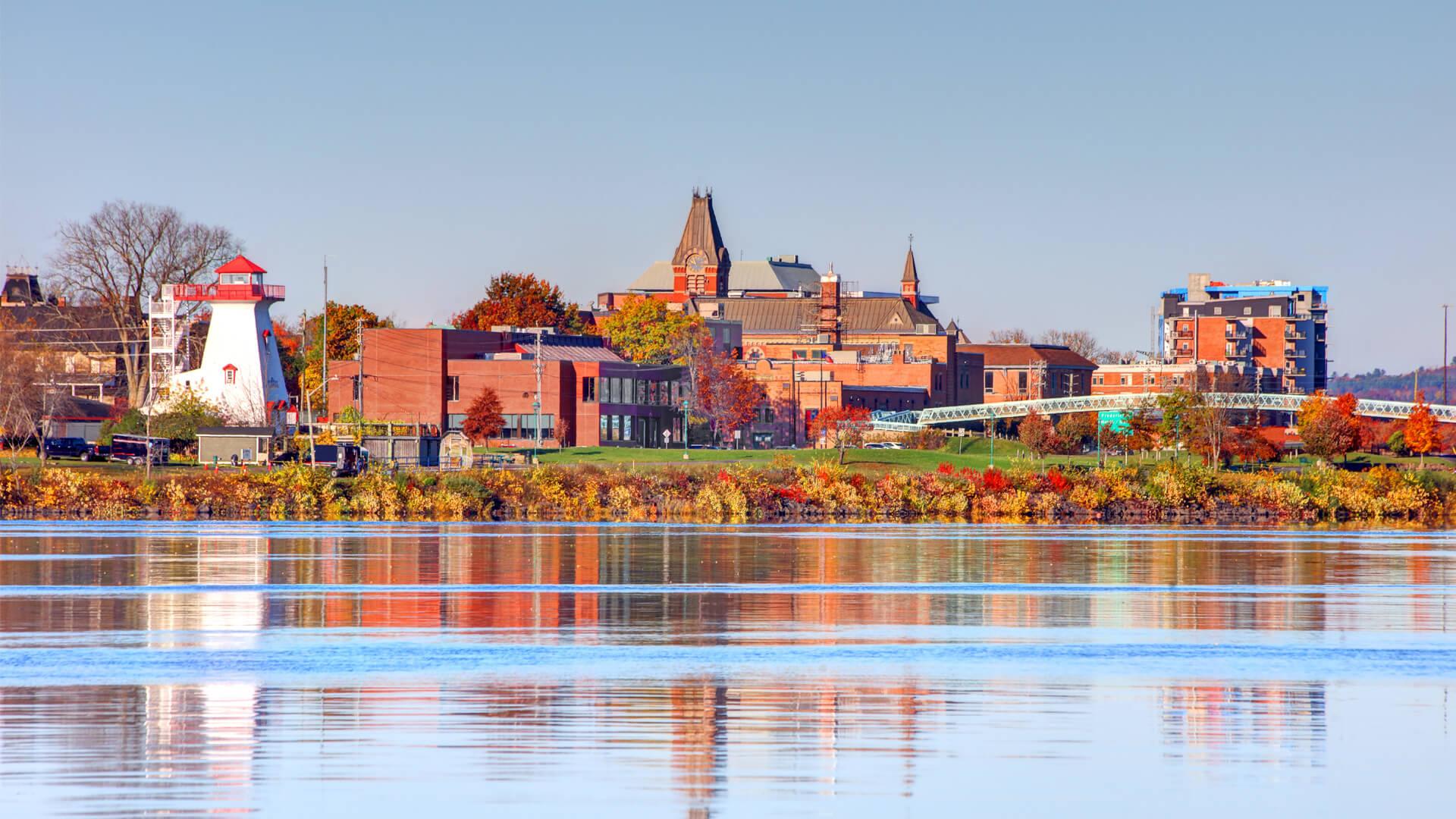 View of downtown Fredericton, New Brunswick, featuring the Fredericton Lighthouse and the Saint John River.