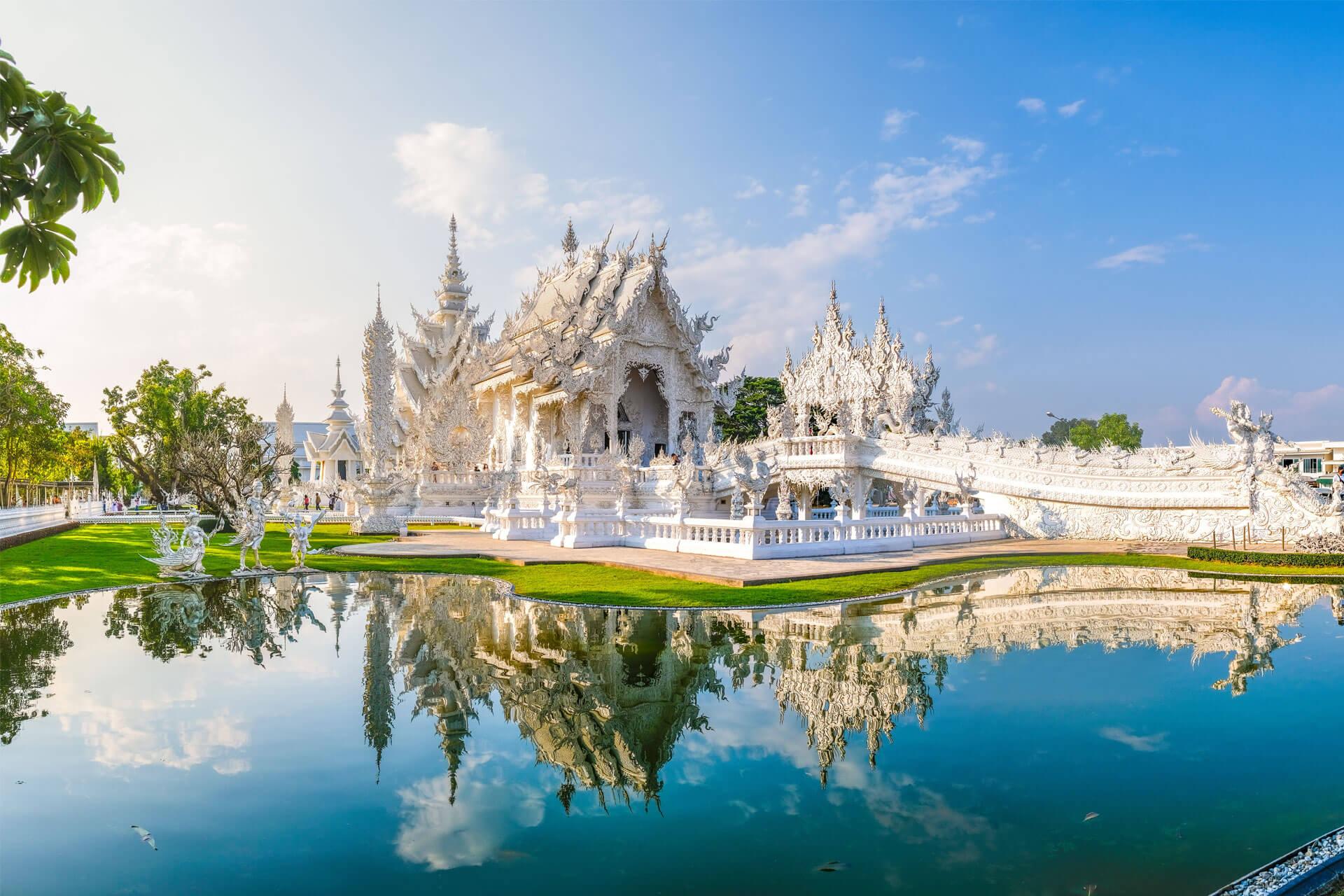White temple, Wat Rong Khun in Chiang Rai, Thailand, featuring its contemporary Buddhist-style architecture.