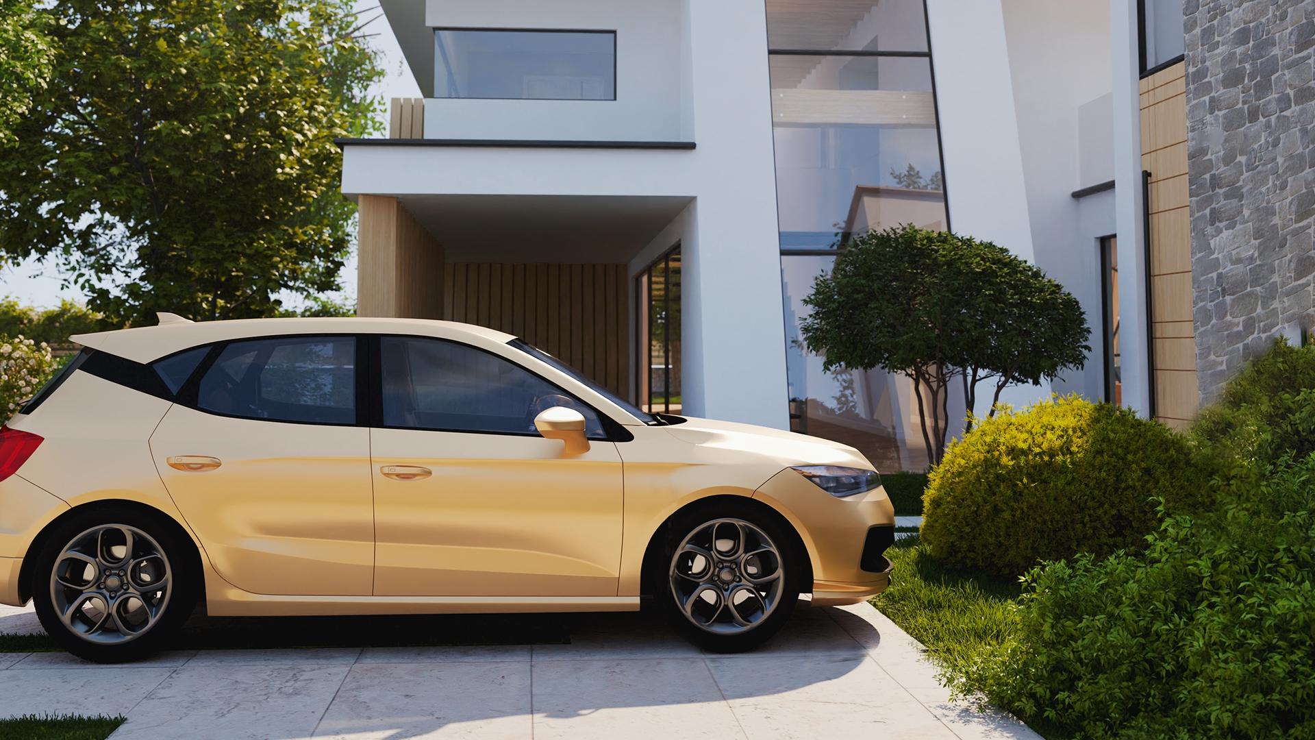 Une voiture dorée est stationnée devant une maison moderne.