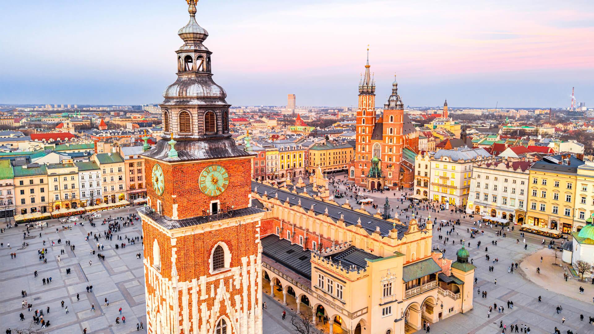 Panoramic view of Kraków’s Main Market Square in Poland, with the Cloth Hall and St. Mary’s Basilica.